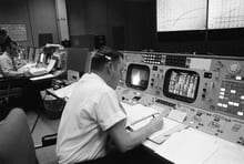 Clifford Charlesworth seated at his console in Mission Control Room