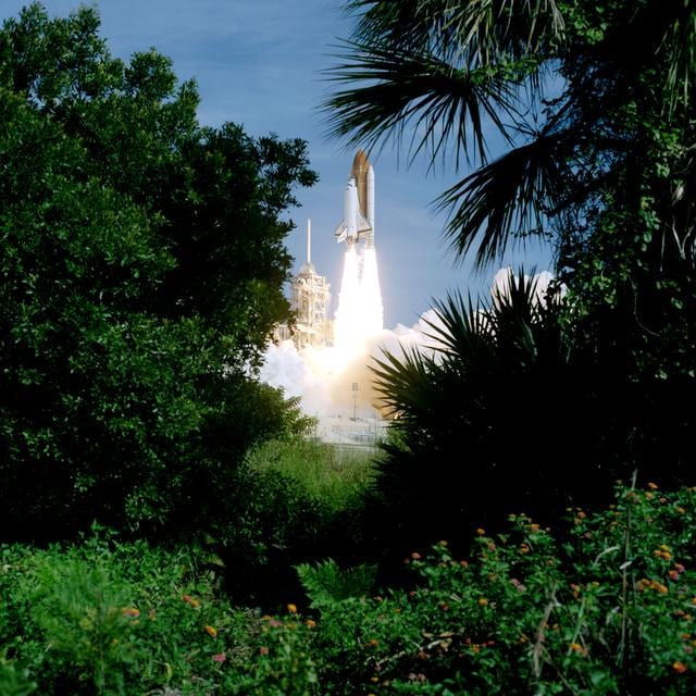 Launch view of the STS-70 space shuttle Discovery