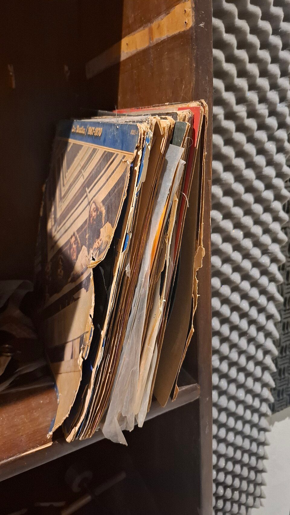 Several vinyl records, worn sleeves
